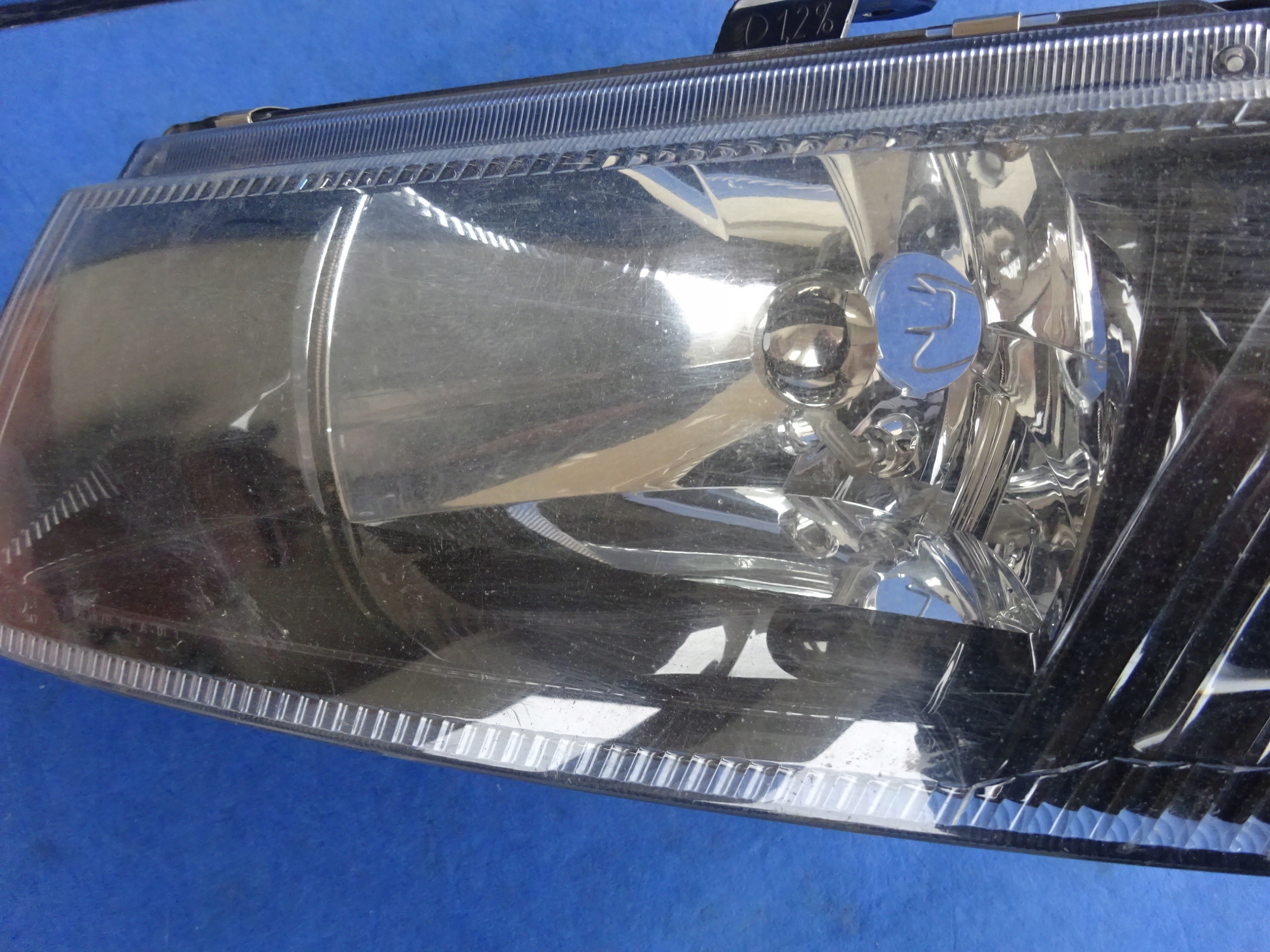 MITSUBISHI CARISMA 00- 2000- LAMPA REFLEKTOR LEWY Producent części Mitsubishi OE