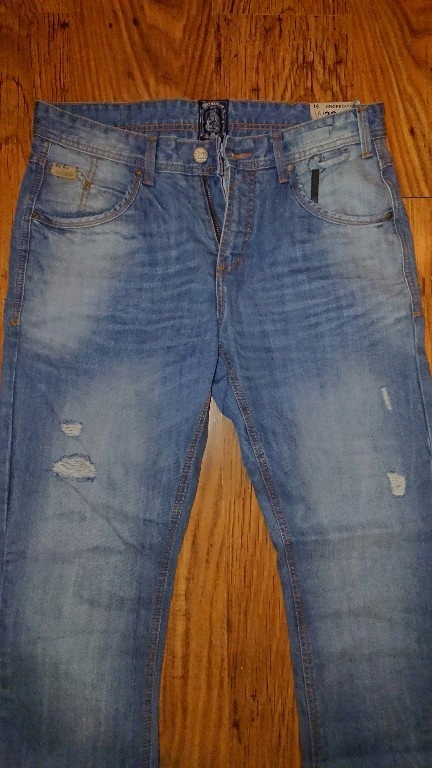 Nowe spodnie jeans Cropp 32/34