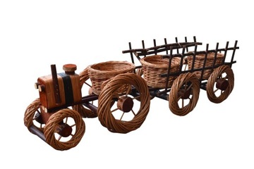 Wicker tractor+ woz bright on flowers garden, фото